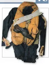  ?? (AS) (AS) ?? ■ Right: The burnt and tattered jacket, trousers, and life jacket worn by James Nicolson during his VC action. The shoe bears damage from a 20mm cannon shell strike. These items are on display at the Tangmere Military Aviation Museum.