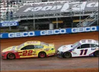  ??  ?? Joey Logano (22) leads Denny Hamlin through Turn 4 during Monday’s NASCAR Cup Series race Monday in Bristol, Tenn. Logano earned his third career victory at Bristol, and Hamlin came in third behind Ricky Stenhouse Jr.
(AP/Wade Payne)