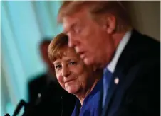  ??  ?? Angela Merkel listens during a press conference with Donald Trump in the East Room of the White House. Photo: AFP/Getty