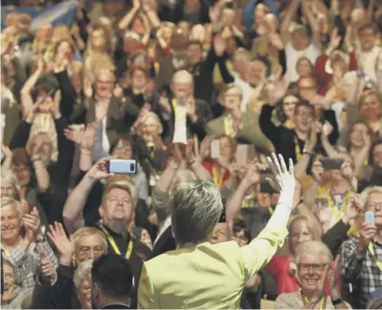  ??  ?? 0 A standing ovation for First Minister Nicola Sturgeon after her speech about options at the SNP conference