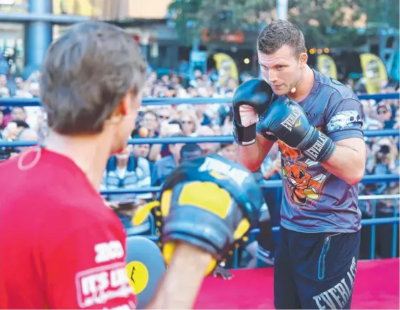  ?? Picture: GETTY IMAGES ?? Jeff Horn hits the pads with trainer Glenn Rushton during a training session at Reddacliff Place in Brisbane yesterday.