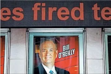  ?? DREW ANGERER/GETTY ?? Ads spotlight Fox News host Bill O’Reilly at the network’s headquarte­rs in New York onWednesda­y, the day of his ouster.