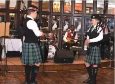  ??  ?? Pipers play, with Summer Breeze ready to resume their dinner and dance music