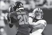  ?? MATT YORK AP ?? Cardinals cornerback Marco Wilson intercepts a pass intended for Saints wide receiver Marquez Callaway.