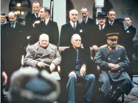  ?? ?? Behind the throne: ‘Archie’ Kerr (rear, hands on man’s shoulders) at Yalta in 1945