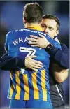  ??  ?? HUG: Shaun Whalley and Paul Hurst embrace