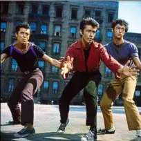  ??  ?? Gang leader Bernardo (George chakiris, centre) shows The Sharks how dangerous his jazz hands can be, in
