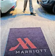  ?? [PHOTO BY DANIEL ACKER, BLOOMBERG] ?? A logo is displayed on a rug outside a Marriott Internatio­nal Inc. hotel in Chicago.