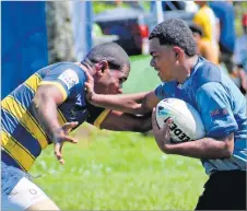  ?? Picture: JONA KONATACI ?? Isimeli Sealolo of Bua Central College fends off a RKS player during the Bati Cup Challenge at the St Marcellin Primary School frounds in Vatuwaqa, Suva yesterday.