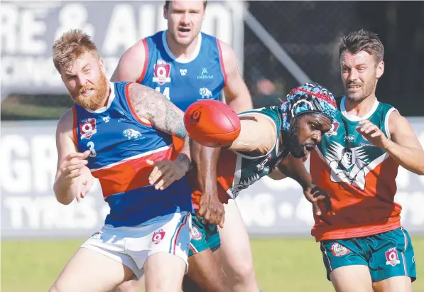  ??  ?? Bulldogs’ Josh Brinn and Cutters’ Dwayne Bosen compete for the footy in the AFL Cairns Seniors match between the South Cairns Cutters and Centrals Trinity Beach Bulldogs, held at Fretwell Park. Picture: Brendan Radke