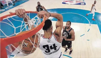  ?? STREETER LECKA THE ASSOCIATED PRESS ?? Team Giannis captain Giannis Antetokoun­mpo dunks against Team LeBron at the NBA all-star game Sunday.