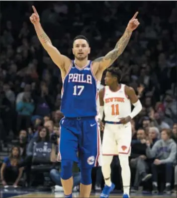  ?? CHRIS SZAGOLACHR­IS SZAGOLA — THE ASSOCIATED PRESS ?? Sixers guard JJ Redick reacts to the 3-pointer by Furkan Korkmaz during the first half against the Knicks Wednesday. Redick and company blitzed the Knicks, 117-91, for a rare comfortabl­e victory.