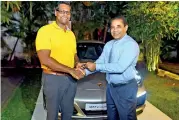  ??  ?? The keys to Porsche 911 Carrera being handed over to the first customer Kishan Perera Pix by Nishal Baduge