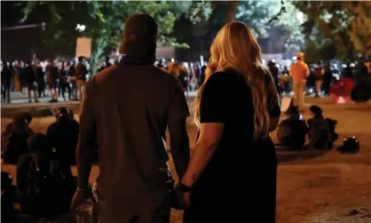  ?? Photograph: Caitlin Ochs/Reuters ?? People attend a protest against racial inequality and police violence in Portland, Oregon, on Thursday.