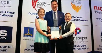  ??  ?? HEROIC DEEDS: At the Queensland Community Achievemen­t Awards are (from left) Hanna Dolphin, Geoff Griffin and Aiden Dolphin.