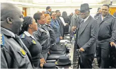  ?? Picture: BRENTON GEACH/GALLO IMAGES ?? SHERIFF’S IN TOWN: Police minister Bheki Cele greets police officers while at parliament to present the 2017/2018 crime statistics to the portfolio committee on police. He briefed the media later