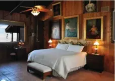  ?? ABE RIVERA/TRIBUNE NEWS SERVICE ?? Frank Sinatra’s bedroom in the rustic main lodge where one of his paintings still hangs. Sinatra hired an architect to custom-design the house in 1967.