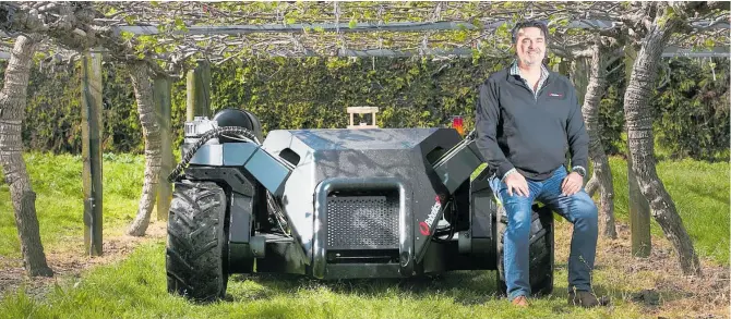  ?? PHOTO / ALAN GIBSON ?? Dr Matt Glenn, CEO of Robotics Plus, with one the company’s UGV’S (Unmanned Ground Vehicle).