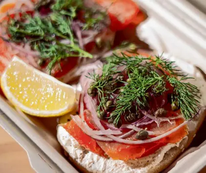  ?? ?? The Lox Tycoon sandwich at Hella Bagels features a dill and scallion schmear topped with Nova lox.