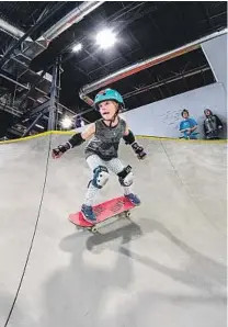  ??  ?? A YOUNG skater navigates the indoor skate park at Woodward Park City. At top, Tyler Metcalf in the Woodward Peace Park.