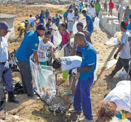  ?? Photo: Perfect Directions ?? Defending Diepsloot: Gekco’s 2014 wetland clean-up in Diepsloot was an operation to help keep the waterways clear of litter and pollutants.