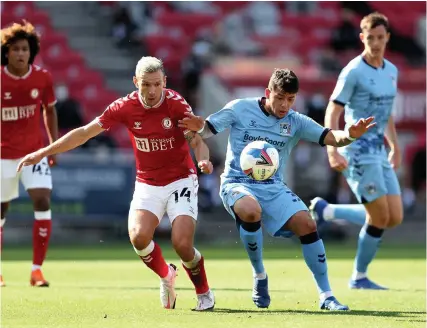  ?? Picture: David Davies/PA ?? Andi Weimann challenges Coventry’s Gustavo Hamer for the ball last September