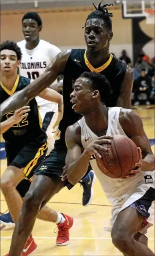  ?? BOB RAINES — DIGITAL FIRST MEDIA ?? Plymouth Whitemarsh’s Ish Horn turns toward the basket in front of Archbishop Wood’s Seth Pinkney Saturday.