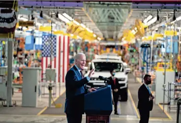  ?? DOUG MILLS/NEW YORK TIMES ?? President Joe Biden speaks at General Motors’ Factory ZERO electric vehicle assembly plant in Detroit on Nov. 17, 2021. The Biden administra­tion is planning some of the most stringent auto pollution limits in the world, designed to ensure that all-electric cars make up as much as 67% of new passenger vehicles sold in the country by 2032.