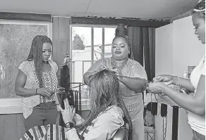  ?? PROVIDED BY INSTITUTE FOR JUSTICE ?? From left, Tedy Okech, Adjo “Charlotte” Amoussou and Sonia Ekemon challenged Idaho’s requiremen­t that braiders become licensed cosmetolog­ists.