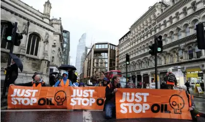 ?? Photograph: Kirsty Wiggleswor­th/AP ?? Just Stop Oil blocking a road in London in October.