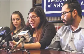  ?? Michelle R. Smith / Associated Press ?? Lilian Calderon (center) was detained by ICE in January after she and her husband, Luis Gordillo (right), attended an interview in Johnston, R.I., to confirm their marriage.