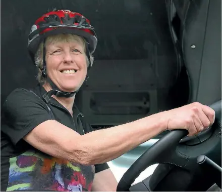  ?? PHOTO: LUCY SWINNEN/ FAIRFAX NZ ?? Cyclist Elaine Richardson in the driving cab of a Mercedes Actros truck.