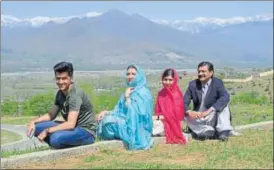  ?? AFP ?? Malala Yousafzai (second from right) with her family during her visit to the Swat Valley.