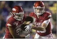  ?? NWA Democrat-Gazette/BEN GOFF ?? Arkansas quarterbac­k Jack Lindsey fakes a handoff to running back Devwah Whaley in the fourth quarter Saturday. Lindsey was 3-of-4 passing for 51 yards and 1 touchdown.