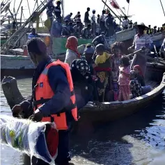  ??  ?? File photo shows Myanmar Navy personnel escorting a group of Rohingya Muslims back to their camp in Sittwe, Rakhine state. — AFP photo