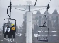  ?? ?? Participan­t Mercedes Wolff (left) chats with volunteer Joel Kennet on Dec. 29 while riding the explorer chairlift at Big Sky Resort.