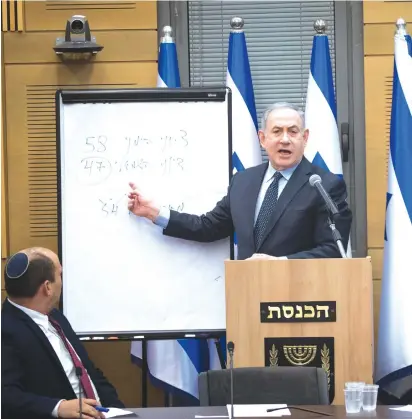  ?? (Yonatan Sindel/Flash90) ?? PRIME MINISTER Benjamin Netanyahu meets with representa­tives from his 58-member right-wing bloc at the Knesset on Wednesday.