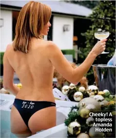  ??  ?? Cheeky! A topless Amanda Holden