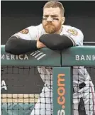  ?? KENNETH K. LAM/BALTIMORE SUN ?? Chris Davis watches from the Orioles dugout during an 8-5 loss to the A’s at Camden Yards last season. Davis hit .179 in 2019 with 12 home runs.