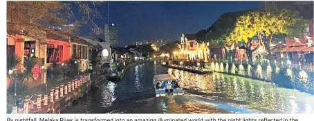  ?? — Photos: MING TEOH/The Star ?? By nightfall, Melaka River is transforme­d into an amazing illuminate­d world with the night lights reflected in the water.