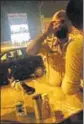  ?? HT PHOTO ?? A video grab showing a constable consuming liquor near a petrol pump in Amritsar on Monday.