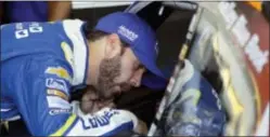 ?? MATT SLOCUM — THE ASSOCIATED PRESS ?? Driver Jimmie Johnson talks with teammate Chase Elliott garage during practice for Sunday’s Pocono 400. in the