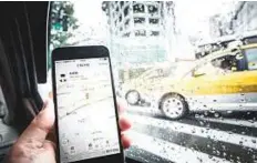  ?? Bloomberg ?? The Didi Chuxing applicatio­n on a smartphone in Shanghai. Didi is in talks with Japan’s Daiichi Koutsu to provide ridehailin­g services for Chinese tourists visiting Japan.