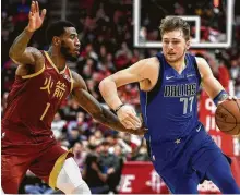  ?? Eric Christian Smith / Associated Press ?? The newest Rocket, Iman Shumpert, made life on offense difficult for the Mavericks’ Luka Doncic, right, on Monday.