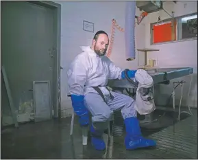  ?? (AP/Oded Balilty) ?? Yehuda Erlich, a worker with Israel’s official Jewish burial society, poses for a photo at a morgue in the central Israeli city of Holon, near Tel Aviv.