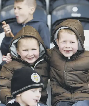  ?? Picture: SNS ?? Gilbert Mowat
Sean Dalrymple
The Club 12th Man
It has been a dismal season for St Mirren, but these two young fans enjoyed Saturday’s victory