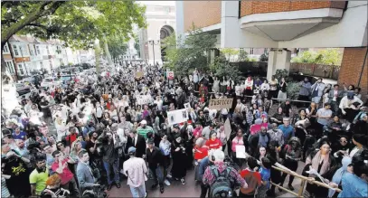  ?? Yui Mok ?? The Associated Press Protesters gather Friday outside Kensington town hall in west London to demand informatio­n about the Grenfell Tower fire.