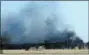  ?? KEVIN HARVISON — THE MCALESTER NEWS-CAPITAL VIA AP, FILE ?? Smoke billows from the site of a gas well fire near Quinton, Okla. A federal report says the explosion and fire that killed five workers at the southeaste­rn Oklahoma natural gas well in 2018 was caused by the failure of blowout prevention devices and other factors.