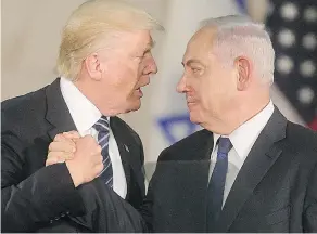  ?? GIL COHEN-MAGEN / AFP / GETTY IMAGES ?? U.S. President Donald Trump and Israel’s Prime Minister Benjamin Netanyahu shake hands at the Israel Museum in Jerusalem on Tuesday.
