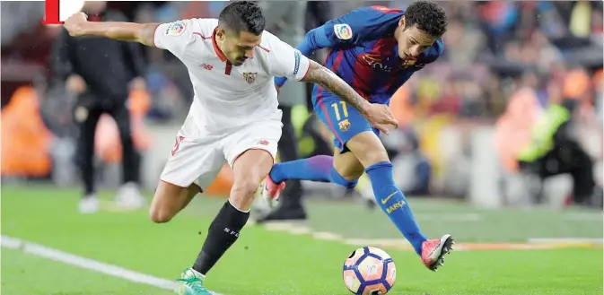  ?? — AFP ?? BARCELONA: Barcelona’s Brazilian forward Neymar (R) vies with Sevilla’s French defender Clement Lenglet during the Spanish league football match FC Barcelona vs Sevilla FC at the Camp Nou stadium in Barcelona yesterday.